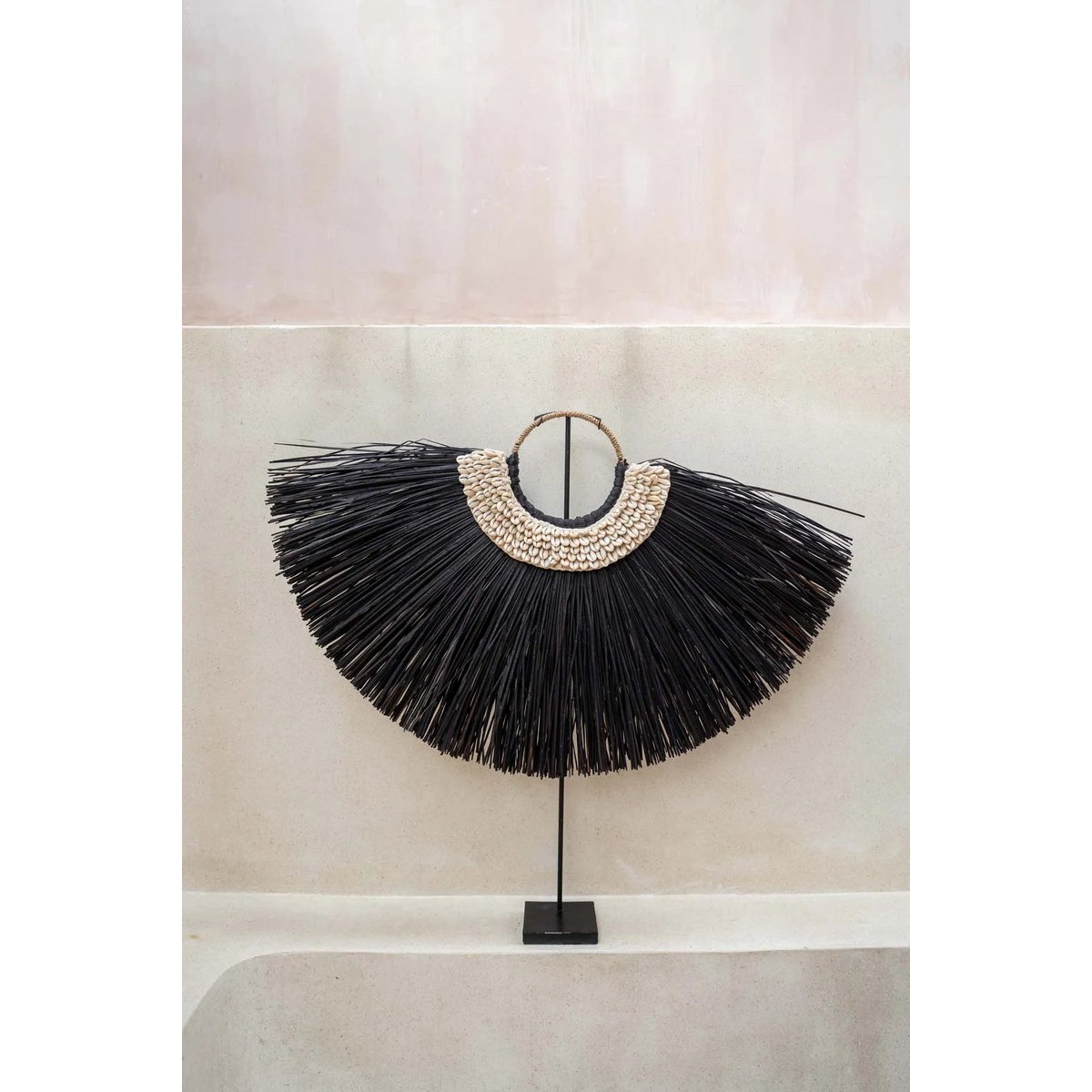 Alang Cowrie op standaard